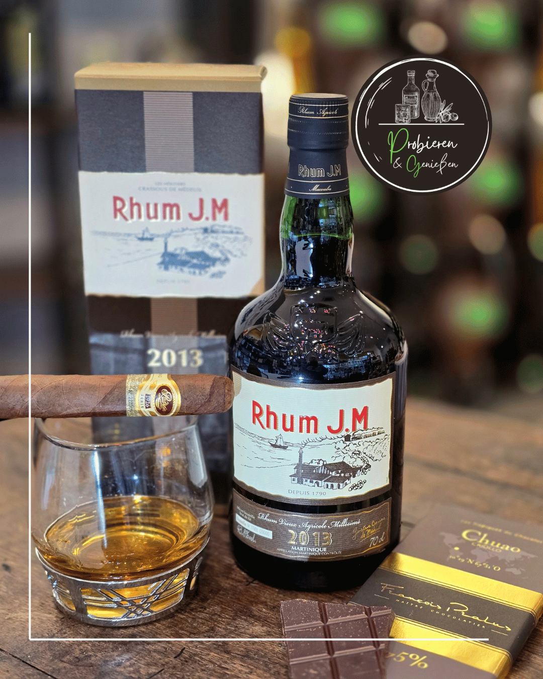 Eine Flasche dunkler Rhum J.M 10 Jahre mit Padron Zigarre und Pralus Chuao Schokolade in Mannheim kaufen